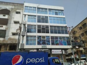 Modern glass elevation office building corner view Badar Commercial DHA Phase 5.