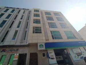 Modern small office for rent in Al Murtaza Commercial DHA Phase 8 Karachi featuring glass elevation, tiled flooring, lift access, and professional corporate environment