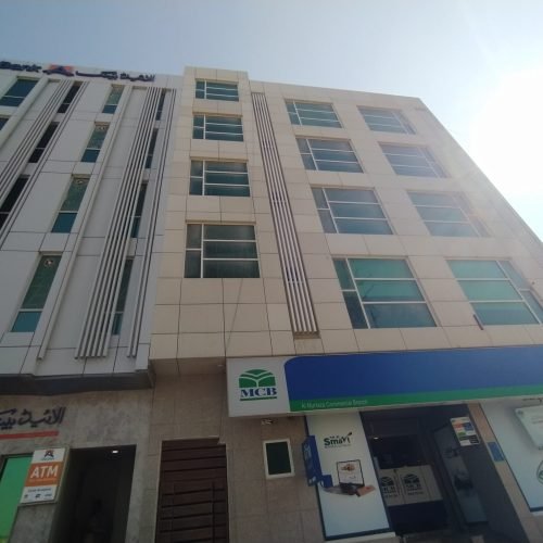 Modern small office for rent in Al Murtaza Commercial DHA Phase 8 Karachi featuring glass elevation, tiled flooring, lift access, and professional corporate environment