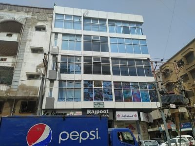 Modern glass elevation office building corner view Badar Commercial DHA Phase 5.