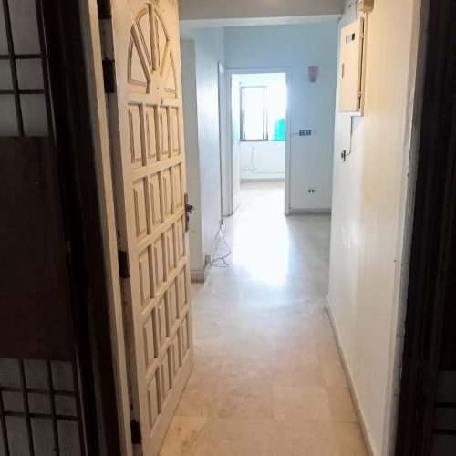Interior of 2-bedroom apartment with marble flooring