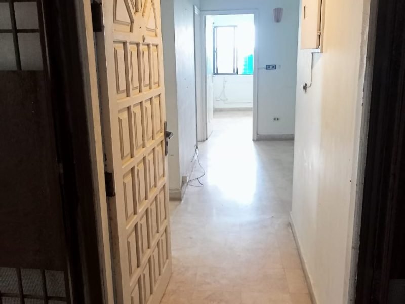 Interior of 2-bedroom apartment with marble flooring